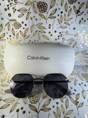 Calvin Klein Men’s Black Frame Sunglasses with Dark Gray Lenses